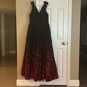 this is a long big sequenced dress in a size Small